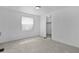 Light-filled bedroom with a closet and neutral carpet at 25 Captains Pt, Fruitland Park, FL 34731