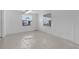 Spacious bedroom with bright lighting and window at 25 Captains Pt, Fruitland Park, FL 34731