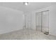 Bedroom features a closet and neutral carpet at 25 Captains Pt, Fruitland Park, FL 34731