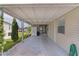 Spacious carport area with a view of the lake, ideal for outdoor activities at 25 Captains Pt, Fruitland Park, FL 34731