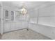 Dining room with large built-in cabinet and chandelier lighting at 25 Captains Pt, Fruitland Park, FL 34731