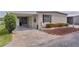 Inviting home with covered parking and well-maintained landscape at 25 Captains Pt, Fruitland Park, FL 34731
