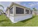 Home with large windows, bright siding and nice landscaping at 25 Captains Pt, Fruitland Park, FL 34731