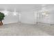 Large living room with new carpet and white wall paneling at 25 Captains Pt, Fruitland Park, FL 34731