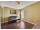 Inviting bedroom with a dark futon, lots of light, and a ceiling fan at 25273 Lost Oak Cir, Leesburg, FL 34748