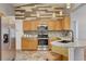 Well-equipped kitchen featuring modern appliances, granite countertops, and custom cabinets at 25273 Lost Oak Cir, Leesburg, FL 34748