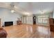 Bright and airy living room featuring hardwood floors, large windows, and neutral paint colors at 25273 Lost Oak Cir, Leesburg, FL 34748