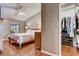 Comfortable main bedroom with ceiling fan and walk-in closet for ample storage at 25273 Lost Oak Cir, Leesburg, FL 34748