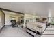 Covered patio area featuring a hot tub and ample space for outdoor living at 25273 Lost Oak Cir, Leesburg, FL 34748
