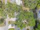 Aerial perspective showcasing the layout of the property, mature trees, and its proximity to the canal at 2529 Cr 448, Lake Panasoffkee, FL 33538