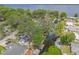 Waterfront home with canal access, mature trees, patio, and a view of the lake at 2529 Cr 448, Lake Panasoffkee, FL 33538
