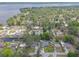 Aerial view of the waterfront neighborhood with lake access and lush greenery at 2529 Cr 448, Lake Panasoffkee, FL 33538