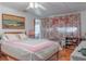 Inviting bedroom with bright, natural light, a comfy bed and a large picture window at 2529 Cr 448, Lake Panasoffkee, FL 33538