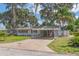 Charming single-story home with driveway and cozy front porch at 2529 Cr 448, Lake Panasoffkee, FL 33538