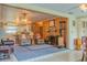Open-concept living space with fireplace and seamless flow to kitchen and dining at 2529 Cr 448, Lake Panasoffkee, FL 33538