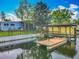 Waterfront property featuring a backyard, private dock, and canal access at 26619 Bimini Dr, Tavares, FL 32778