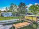 Waterfront property featuring a backyard, private dock, and canal access at 26619 Bimini Dr, Tavares, FL 32778