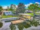 Waterfront property featuring a backyard, private dock, and canal access at 26619 Bimini Dr, Tavares, FL 32778