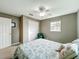 Bedroom featuring neutral walls, a ceiling fan, a closet, and a sunny window at 26619 Bimini Dr, Tavares, FL 32778