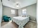 Bright bedroom featuring a ceiling fan, neutral walls, and a sunny window at 26619 Bimini Dr, Tavares, FL 32778