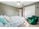 Neutral bedroom featuring a closet, ceiling fan, and a sunny window at 26619 Bimini Dr, Tavares, FL 32778