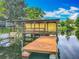 Private boat dock and lift offering direct water access for boating and recreation at 26619 Bimini Dr, Tavares, FL 32778