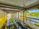 Covered boat dock featuring a boat lift, overlooking the waterfront at 26619 Bimini Dr, Tavares, FL 32778