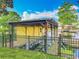 Private boat dock and covered slip offering direct access to the serene waterfront, perfect for boating at 26619 Bimini Dr, Tavares, FL 32778