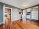 Stylish living room featuring hardwood floors, built-in shelves, and stylish decor at 26619 Bimini Dr, Tavares, FL 32778