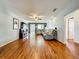 Open concept living room featuring hardwood floors, recessed lighting, and access to other living spaces at 26619 Bimini Dr, Tavares, FL 32778