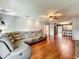 Spacious living room with hardwood floors, an open layout, recessed lighting, and a ceiling fan at 26619 Bimini Dr, Tavares, FL 32778
