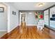 Cozy living room featuring hardwood floors, built-in shelves, and stylish decor at 26619 Bimini Dr, Tavares, FL 32778