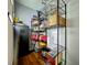 Organized pantry with wire shelving stocked with food and household goods, plus a secure safe at 26619 Bimini Dr, Tavares, FL 32778
