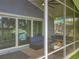 Relaxing screened patio featuring cozy seating and a modern fire pit, with serene lake views at 26619 Bimini Dr, Tavares, FL 32778