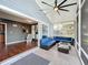 Inviting screened-in porch with seamless indoor-outdoor flow and comfortable waterfront seating at 26619 Bimini Dr, Tavares, FL 32778