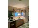 Bedroom featuring a built-in vanity with storage and framed artwork at 313 Palo Verde Dr, Leesburg, FL 34748