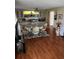 Formal dining area featuring elegant furnishings, decorative built-in storage, and gleaming hardwood floors at 313 Palo Verde Dr, Leesburg, FL 34748