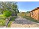 Backyard with partial grass, fence, and trees at 316 Betty Ln, Mascotte, FL 34753