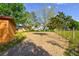 Backyard featuring trees, partial grass, and a fence at 316 Betty Ln, Mascotte, FL 34753