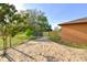 View of the backyard with partial grass, fence, and trees at 316 Betty Ln, Mascotte, FL 34753