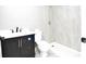 Bathroom featuring modern vanity, sleek toilet, and walk-in shower with tiled surround at 316 Betty Ln, Mascotte, FL 34753