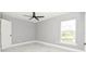 Comfortable bedroom featuring modern ceiling fan, bright window, and sleek gray color scheme at 316 Betty Ln, Mascotte, FL 34753