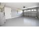 Garage with painted walls and an epoxy floor at 316 Betty Ln, Mascotte, FL 34753