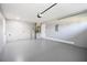 Spacious garage with epoxy flooring, block walls and a water heater at 316 Betty Ln, Mascotte, FL 34753