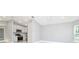 Open-concept kitchen and living room space featuring recessed lighting and tile flooring at 316 Betty Ln, Mascotte, FL 34753