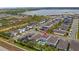 An aerial view showcasing a home, private pool, lake, well-maintained lawns, and a friendly neighborhood at 3235 Buoy Cir, Winter Garden, FL 34787