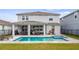 Inviting backyard featuring a covered patio, swimming pool, and spa, perfect for outdoor entertaining at 3235 Buoy Cir, Winter Garden, FL 34787