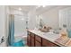 Functional bathroom featuring a shower-tub combo, double sink vanity and bright lighting at 3235 Buoy Cir, Winter Garden, FL 34787