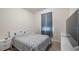 A simple, cozy bedroom with a comfortable queen-sized bed, side tables, and a TV at 3235 Buoy Cir, Winter Garden, FL 34787