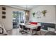 An inviting dining room with a long table, stylish lighting, and easy access to the outdoor area at 3235 Buoy Cir, Winter Garden, FL 34787